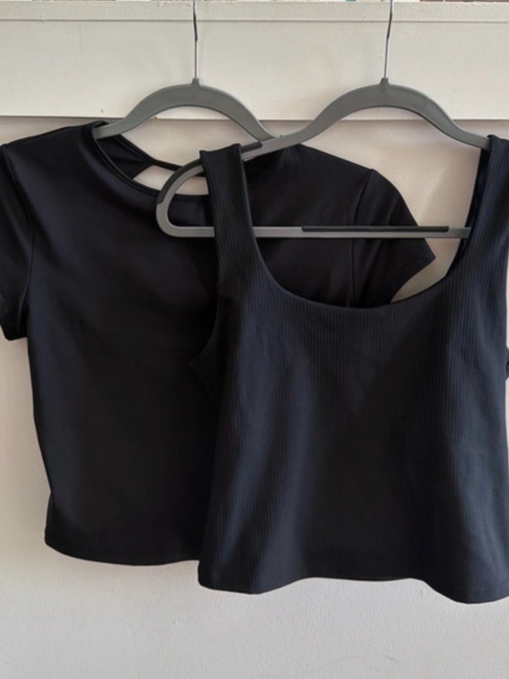 2 black crop tops